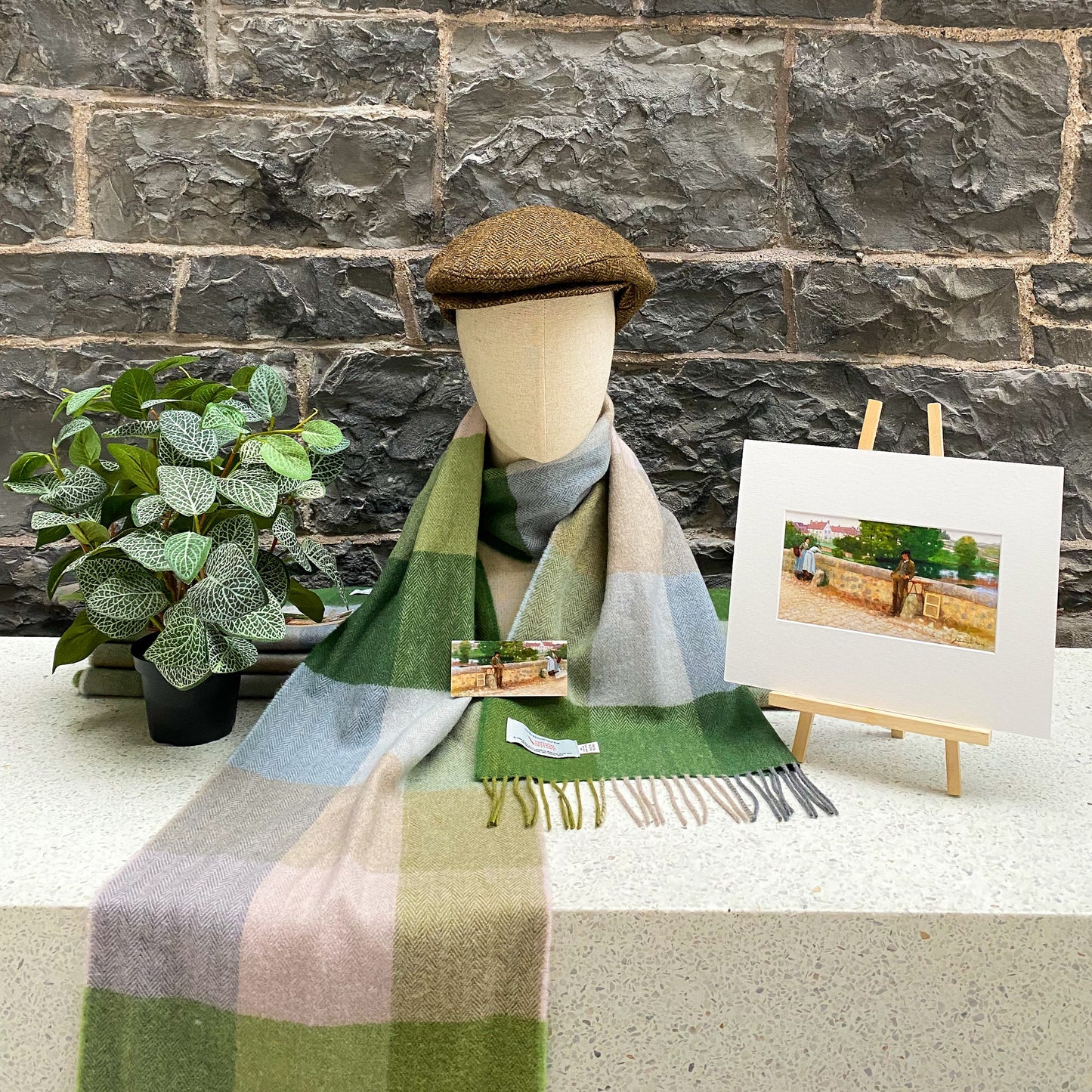 mannequin with hat and scarf with a three block pattern