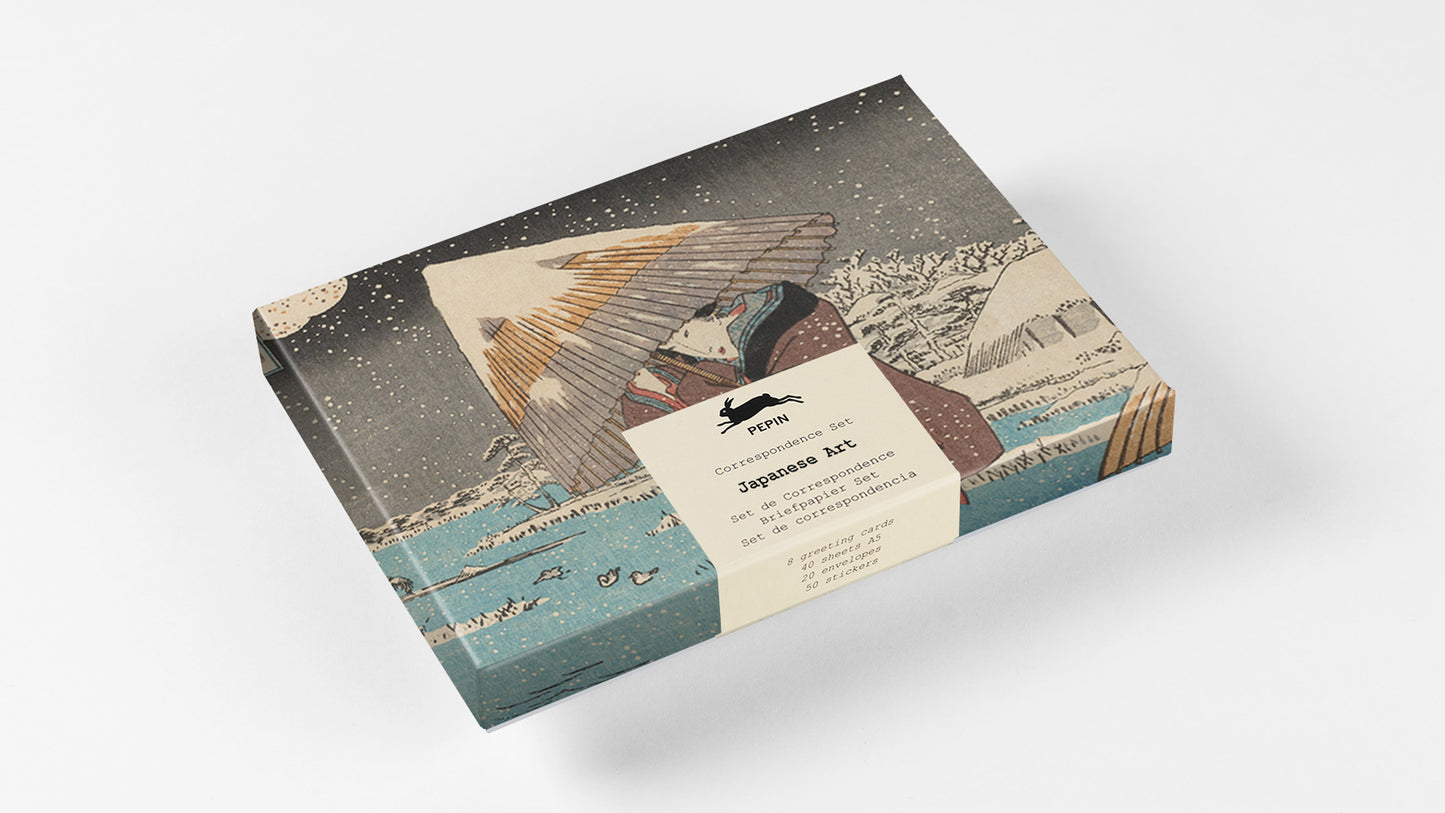 A rectangular product box featuring a vintage Japanese ukiyo-e style illustration with a sailboat, mountains, and a figure, wrapped with a cream paper label. The box is photographed at an angle on a clean white background.