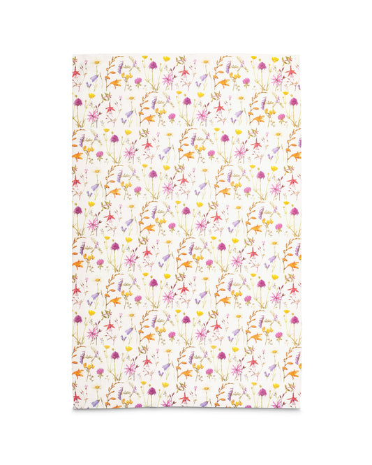 The rectangular tea towel laid out flat showing the repeating pattern of flowers.