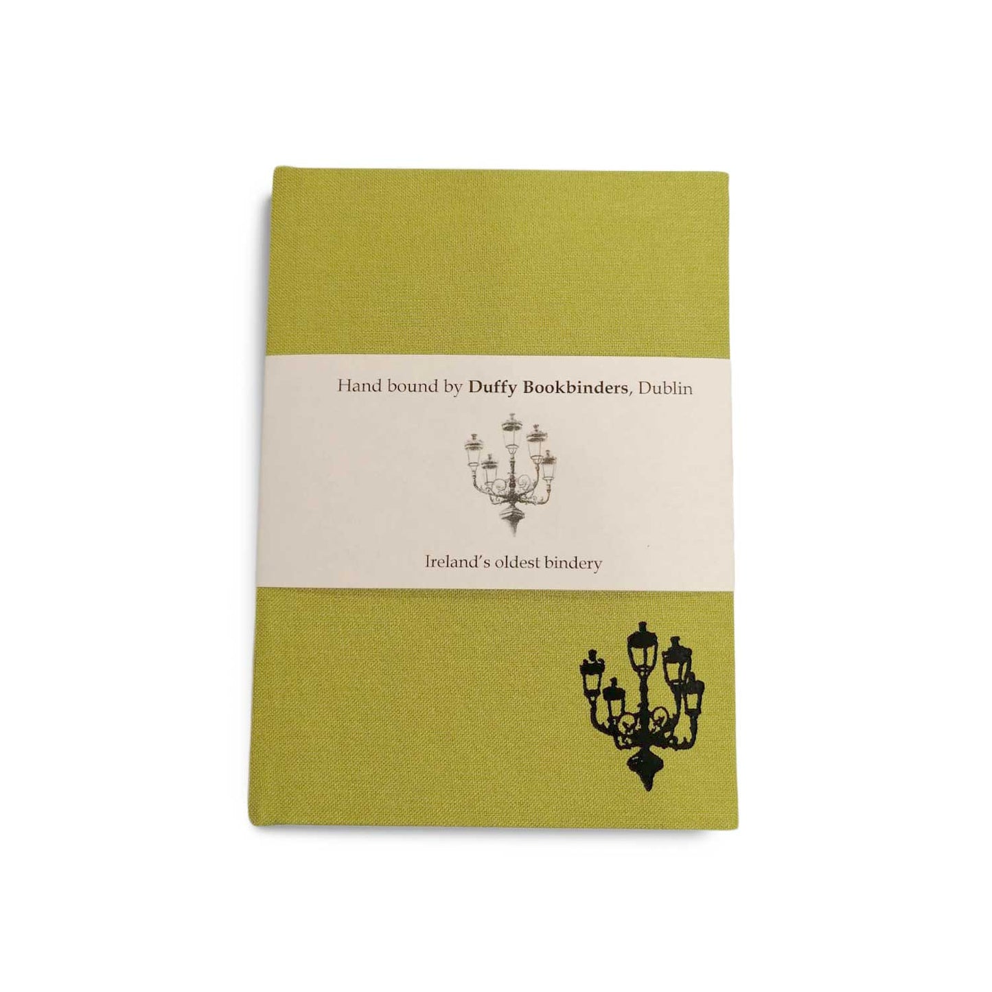 A lime green clothbound notebook with a cream belly band around the centre. There is a simple line illustration of a street lamp with five lanterns in the bottom right corner of the notebook and on the band.