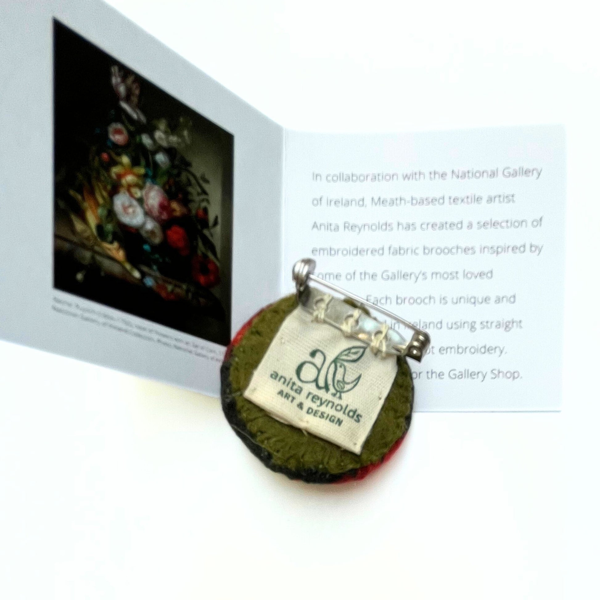 Reverse of Anita Reynolds brooch based on Vase of Flowers with an Ear of Corn by Ruysch with box insert