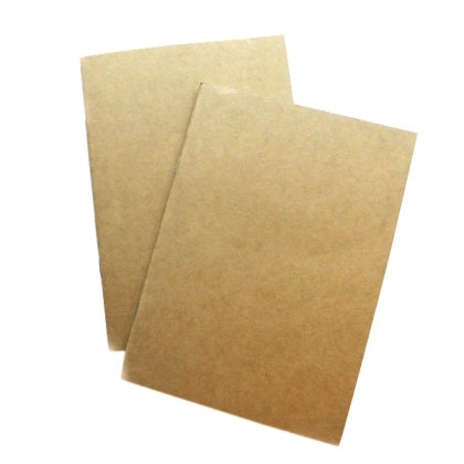A plain light brown notebook cover. A small white sticker in the corner has the barcode and paper details.