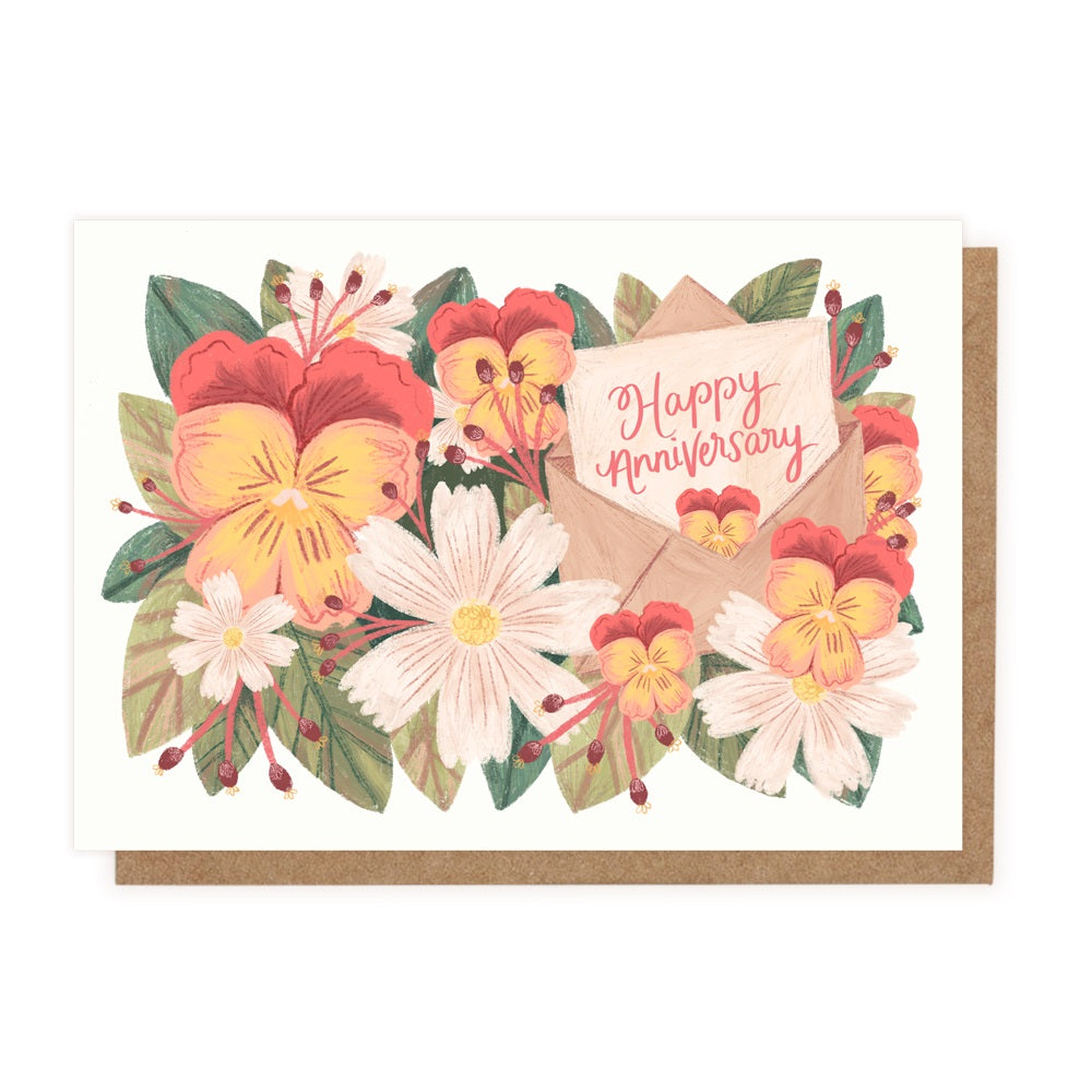 A drawing of pansies, daisies and green leaves with a small card that says Happy Anniversary in cursive.